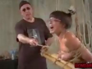 Grown Asian Slave Tortured with Metal Dildo and Tit.