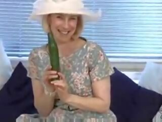 Middle-aged housewife fucks a cucumber